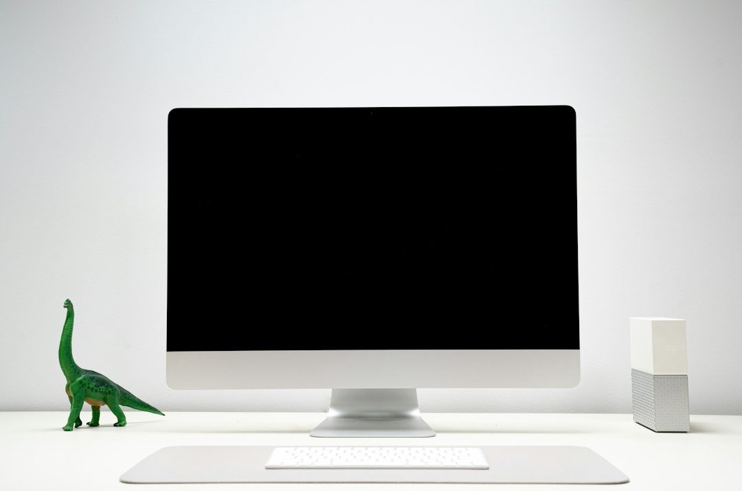 Minimal desktop computer setup on a white desk