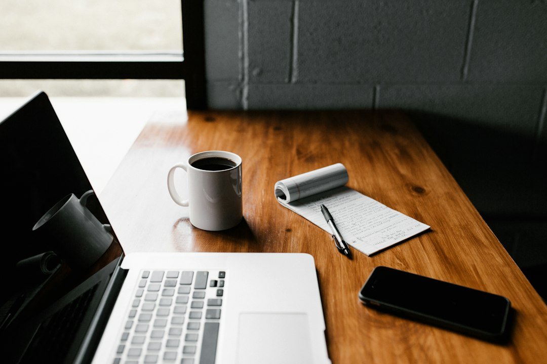 Laptop and everyday work accessories on a desk