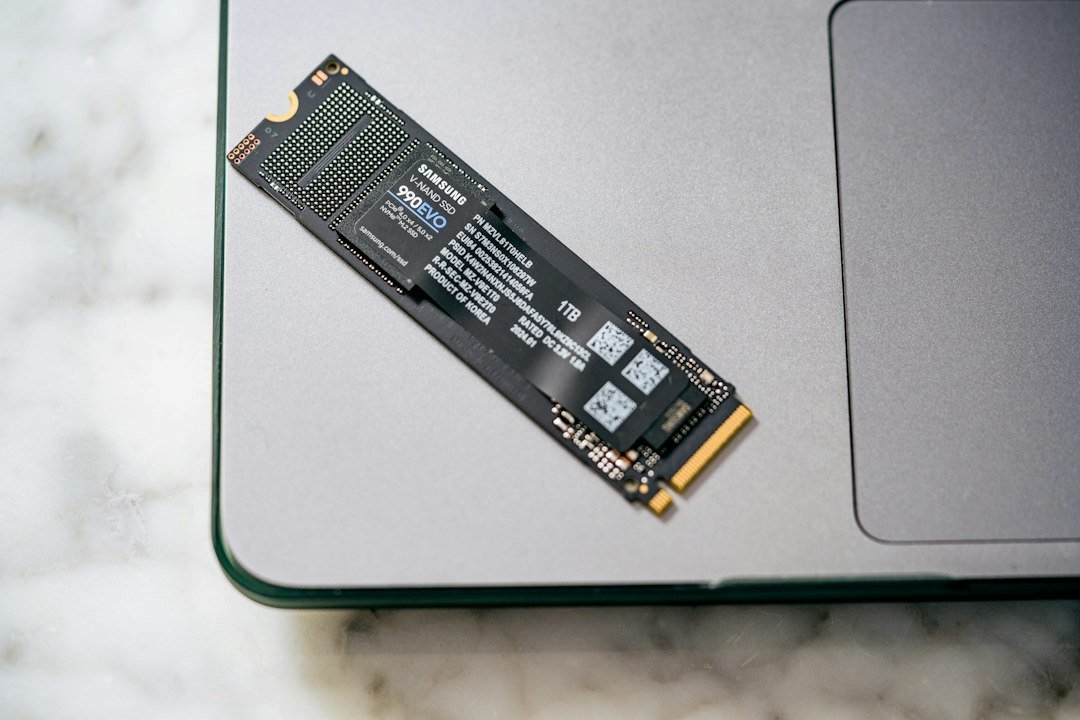 M.2 solid state drive beside a laptop
